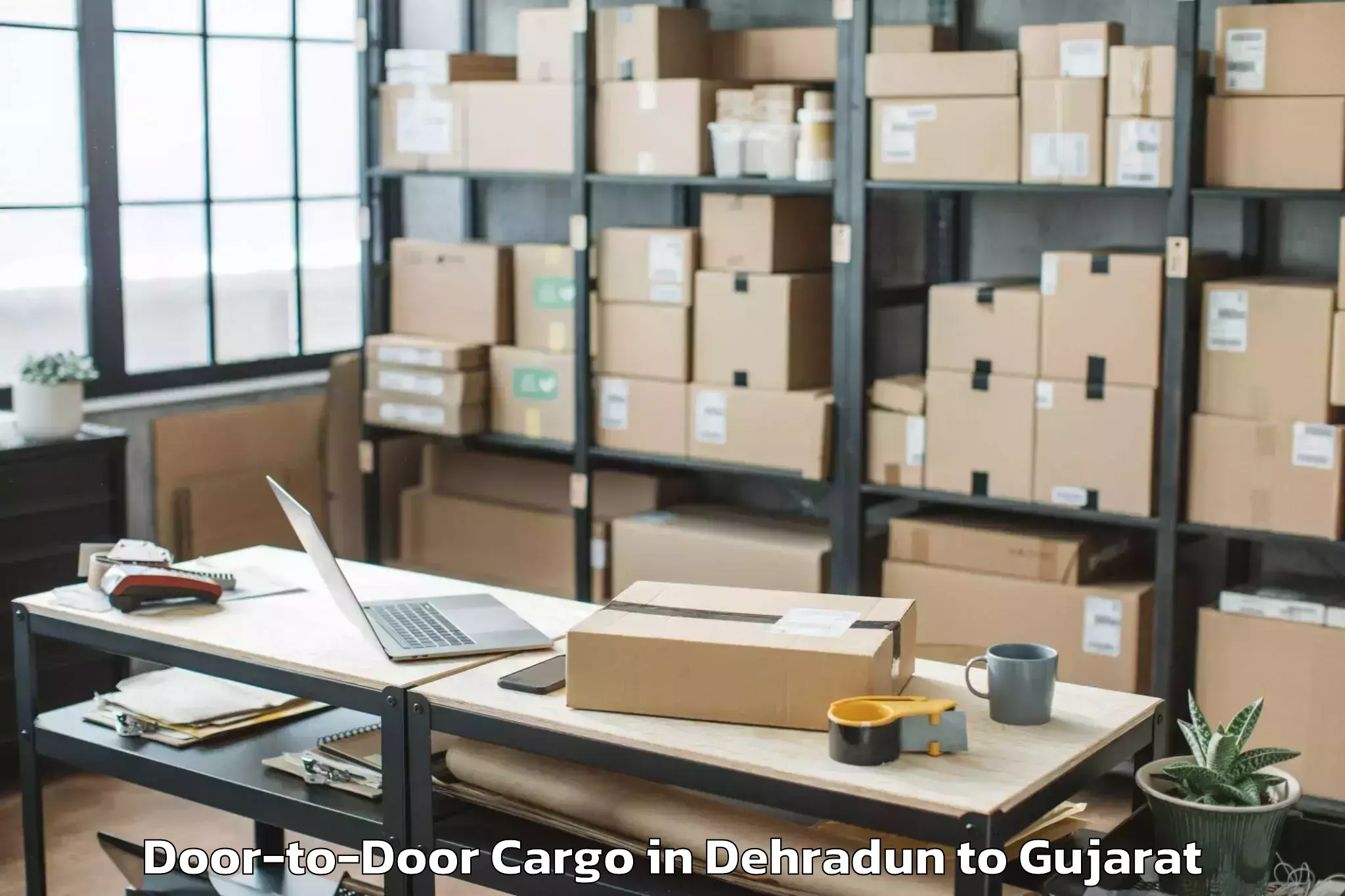 Leading Dehradun to Saurashtra University Rajkot Door To Door Cargo Provider